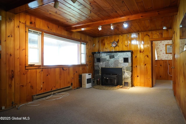 6222 Rte 9n, Hadley, NY 12835 - unfurnished living room with a baseboard heating unit, carpet, wood walls, wood ceiling, and a wood stove