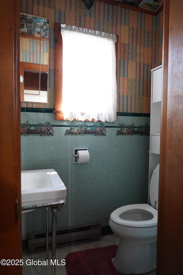 6222 Rte 9n, Hadley, NY 12835 - half bathroom with toilet, tile patterned flooring, tile walls, and baseboard heating