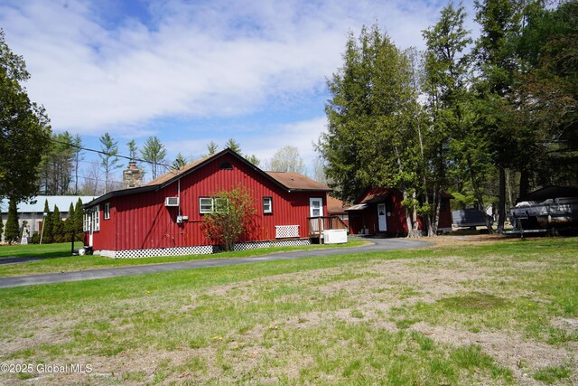 6222 Rte 9n, Hadley, NY 12835 - view of home's exterior featuring a lawn and a chimney