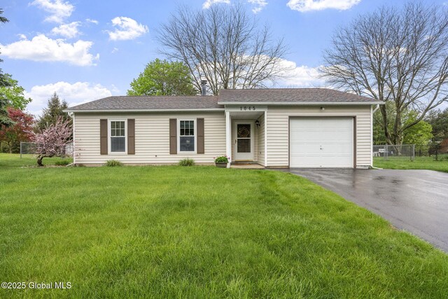 ranch-style home with a garage, driveway, a chimney, and roof with shingles