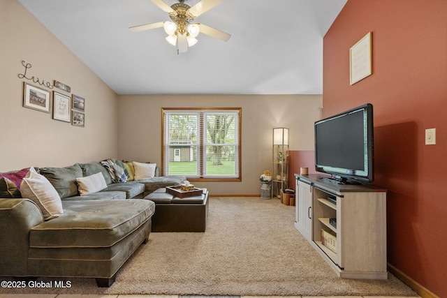 living room with ceiling fan, light carpet, and baseboards