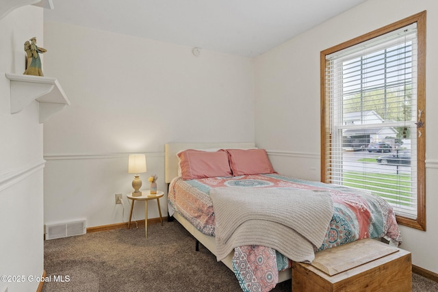 carpeted bedroom with baseboards