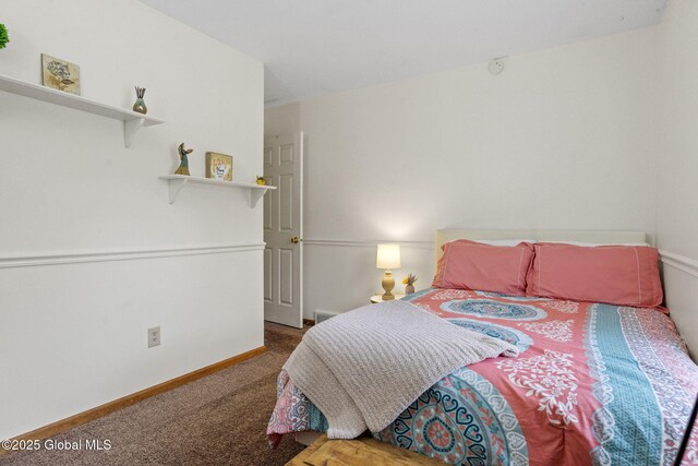 bedroom featuring carpet floors and baseboards