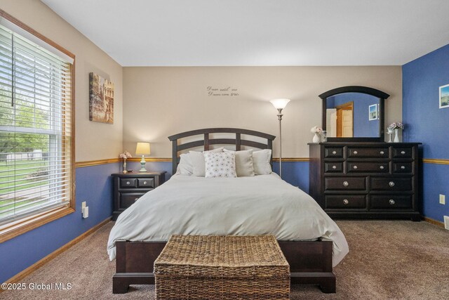 bedroom featuring carpet flooring and baseboards
