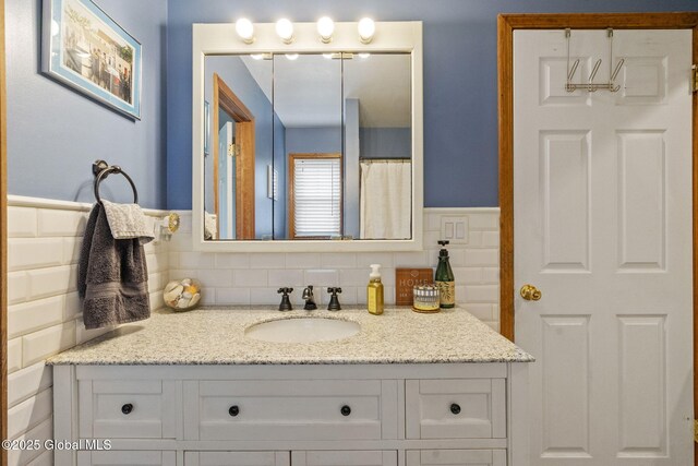 full bathroom featuring vanity and decorative backsplash