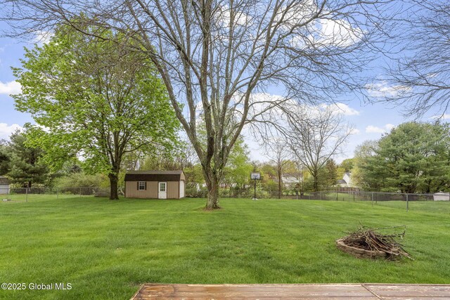 view of yard with an outdoor structure and a shed
