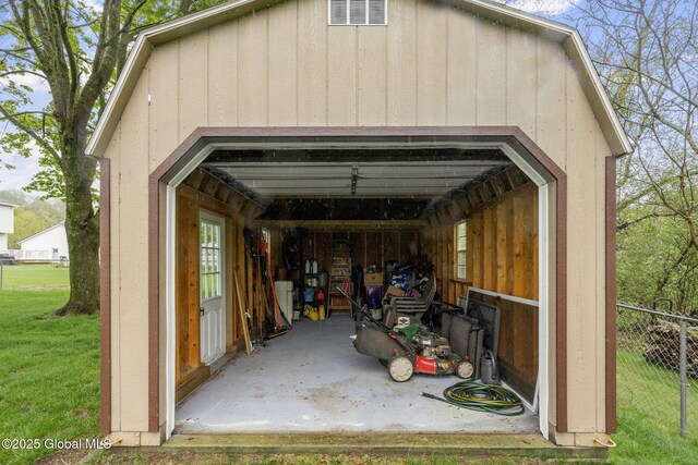 view of parking / parking lot with a detached garage