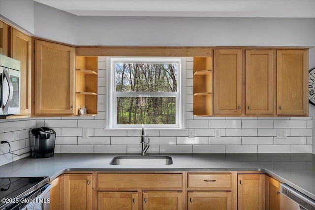kitchen featuring open shelves, a sink, appliances with stainless steel finishes, and backsplash