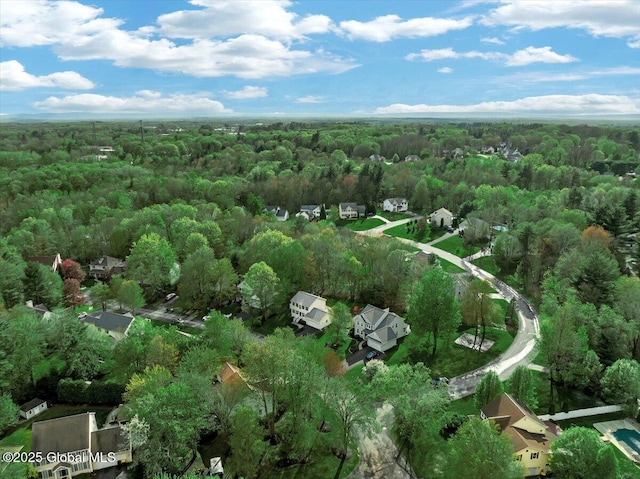 aerial overview of property's location featuring a heavily wooded area