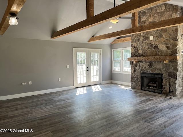 unfurnished living room with beam ceiling, french doors, baseboards, and a fireplace