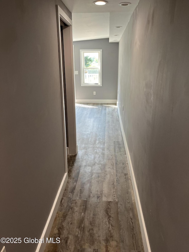 hall with dark wood-type flooring