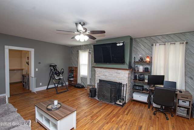 130 Kelly Ln, Mohawk, NY 12068 - living area featuring a ceiling fan, a fireplace, and wood-type flooring
