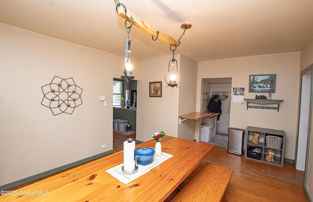 dining space featuring wood finished floors