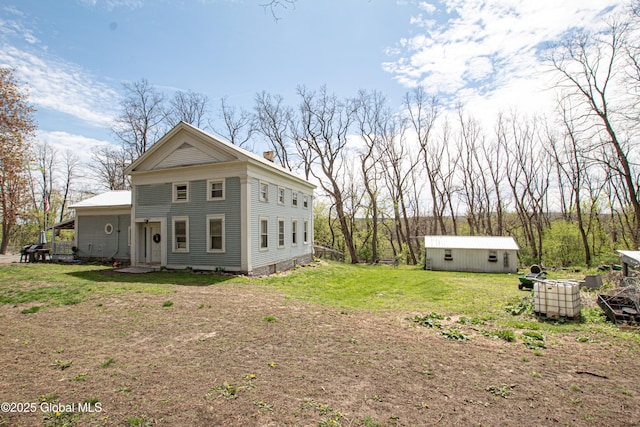 130 Kelly Ln, Mohawk, NY 12068 - view of property exterior featuring an outbuilding and a lawn