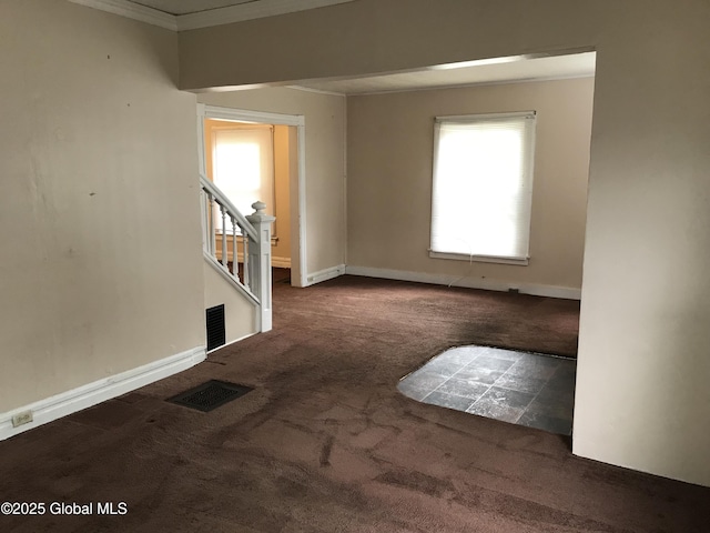 23 Orville St, Glens Falls, NY 12801 - unfurnished room featuring carpet floors, healthy amount of natural light, ornamental molding, stairway, and baseboards