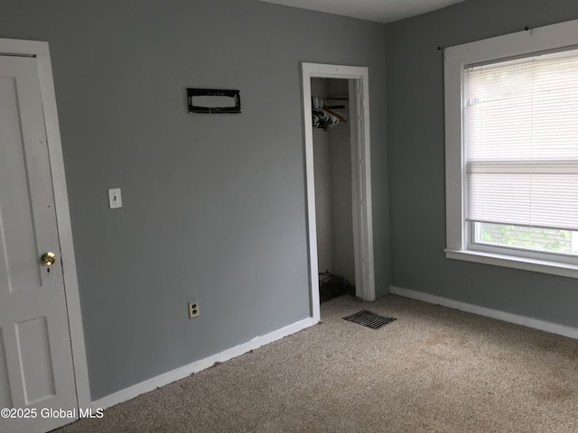 23 Orville St, Glens Falls, NY 12801 - unfurnished bedroom with carpet flooring, baseboards, and a closet