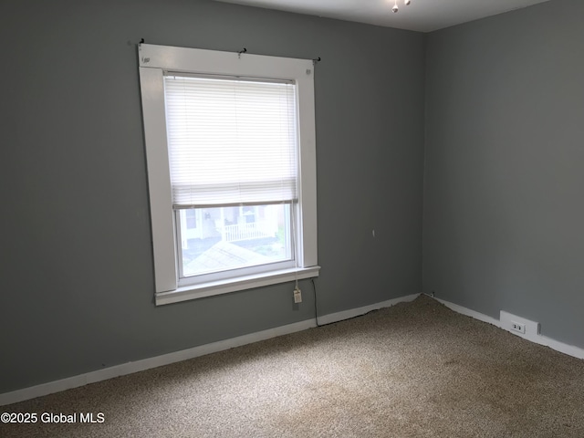 23 Orville St, Glens Falls, NY 12801 - carpeted spare room featuring baseboards