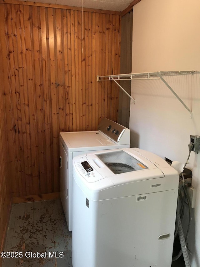 23 Orville St, Glens Falls, NY 12801 - laundry room with washing machine and dryer and wood walls