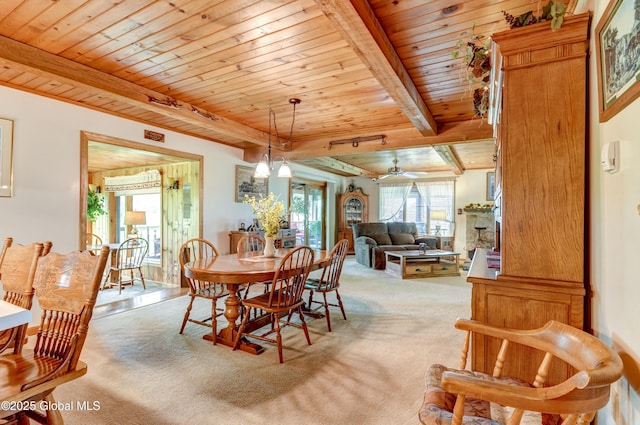 506 Nellis Rd, Palatine, NY 13339 - dining area featuring wood ceiling, light colored carpet, a ceiling fan, and beam ceiling