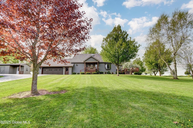 506 Nellis Rd, Palatine, NY 13339 - ranch-style house featuring a garage, a front lawn, concrete driveway, and a deck