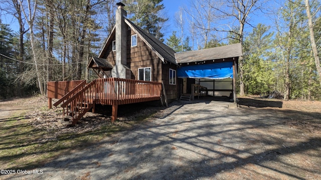 47 Davis Rd, Schroon, NY 12870 - exterior space with a chimney, stairs, a wooden deck, and a shingled roof