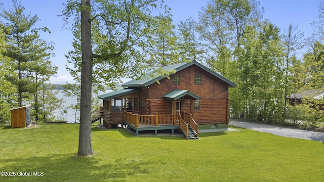 89 Captains Cv, Crown Point, NY 12928 - view of front of property with stairs, a front yard, log siding, and a deck