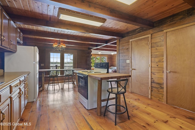 89 Captains Cv, Crown Point, NY 12928 - kitchen with white appliances, wooden counters, wood ceiling, light wood-style flooring, and a chandelier