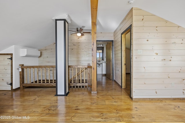 89 Captains Cv, Crown Point, NY 12928 - corridor with an AC wall unit, wooden walls, light wood-style floors, and baseboards
