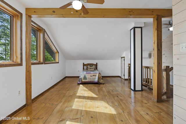 89 Captains Cv, Crown Point, NY 12928 - unfurnished bedroom featuring light wood-style flooring, lofted ceiling, and baseboards