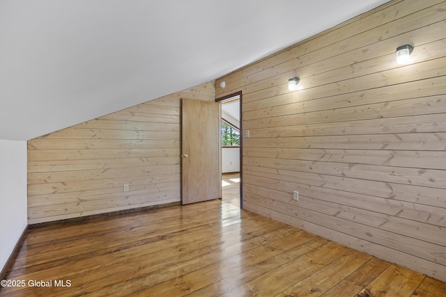 89 Captains Cv, Crown Point, NY 12928 - additional living space featuring lofted ceiling, wood-type flooring, and wood walls
