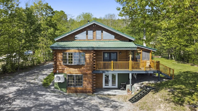 89 Captains Cv, Crown Point, NY 12928 - rear view of house with french doors, log exterior, a yard, a deck, and ac unit