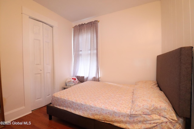 bedroom featuring wood finished floors and a closet