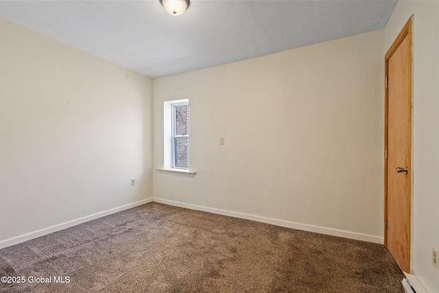 carpeted empty room featuring baseboards and a baseboard heating unit