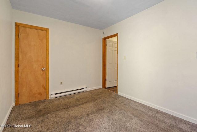 carpeted empty room with a baseboard radiator and baseboards