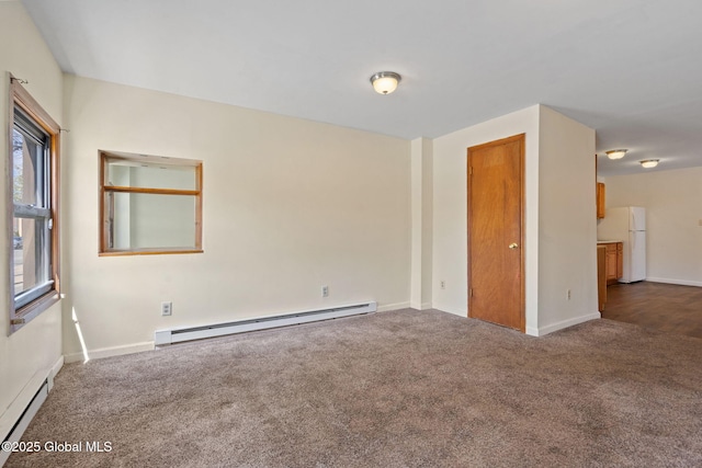 unfurnished room with dark colored carpet, baseboards, and baseboard heating