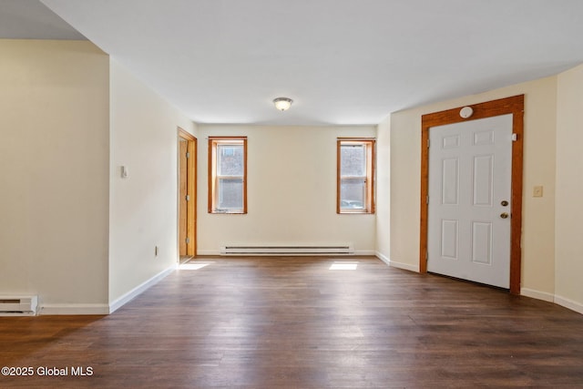 foyer with baseboards, dark wood-type flooring, a baseboard radiator, and baseboard heating