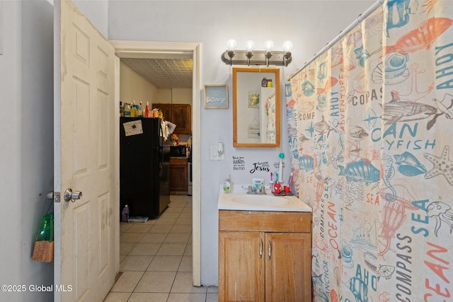 full bath featuring tile patterned flooring and vanity