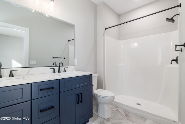 full bath featuring toilet, a shower stall, and a sink