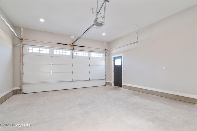 garage featuring recessed lighting, baseboards, and a garage door opener