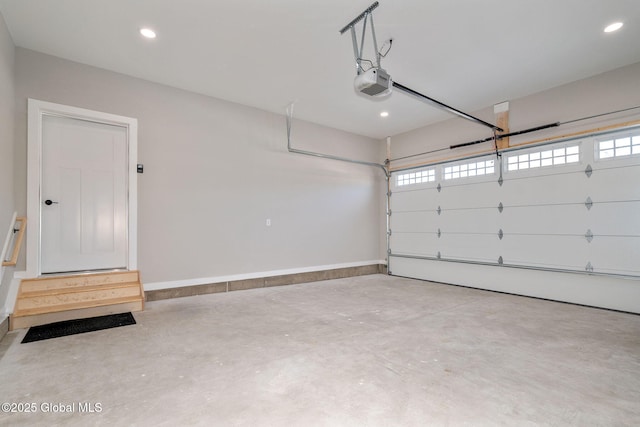 garage with recessed lighting, baseboards, and a garage door opener