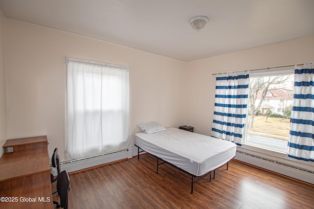 27 Kingsboro Ave, Gloversville, NY 12078 - bedroom with a baseboard heating unit and wood finished floors