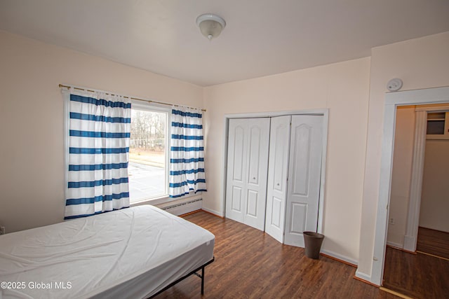 27 Kingsboro Ave, Gloversville, NY 12078 - bedroom with a closet, baseboards, baseboard heating, and wood finished floors