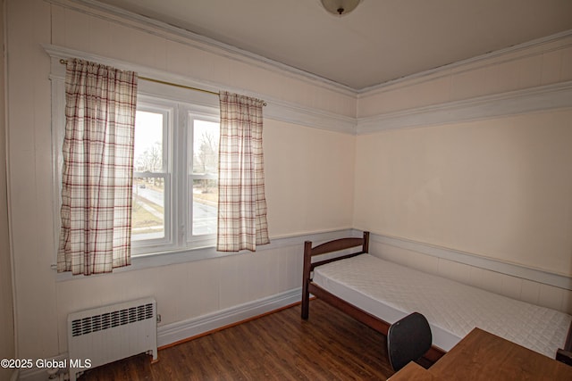 27 Kingsboro Ave, Gloversville, NY 12078 - unfurnished bedroom with ornamental molding, wood finished floors, multiple windows, and radiator heating unit