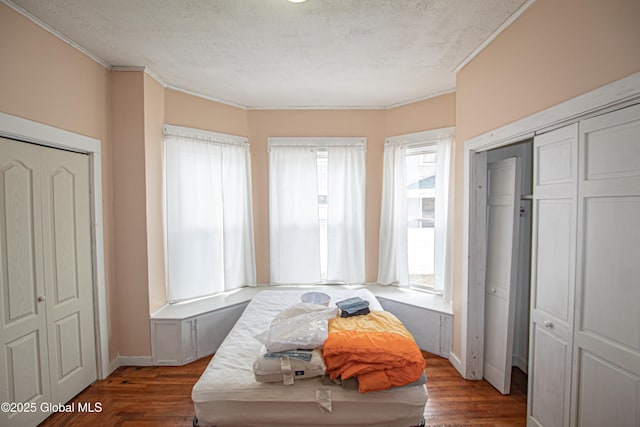 27 Kingsboro Ave, Gloversville, NY 12078 - bedroom with a textured ceiling, wood finished floors, and ornamental molding