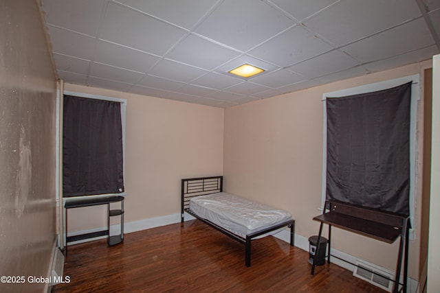 27 Kingsboro Ave, Gloversville, NY 12078 - bedroom featuring a baseboard radiator, wood finished floors, baseboards, and a drop ceiling