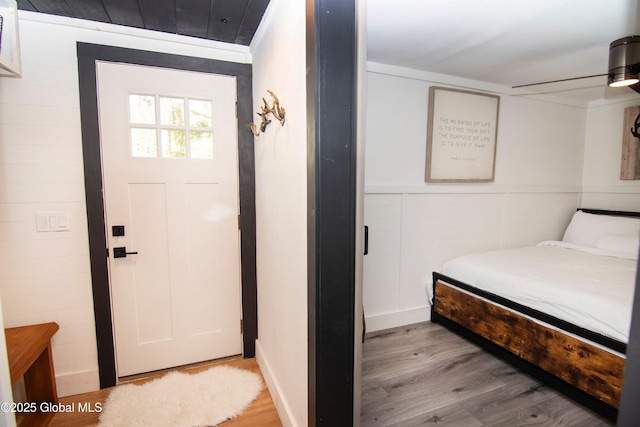 433 Lake Desolation Rd, Greenfield, NY 12850 - bedroom with light wood-style flooring and wainscoting