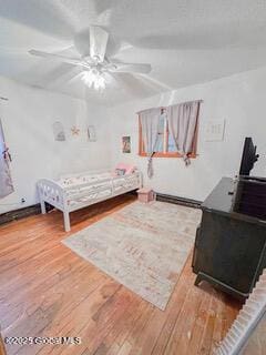 bedroom featuring hardwood / wood-style floors and ceiling fan