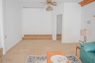 living room with ceiling fan