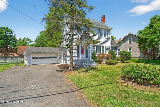 5 Hillview Ave, East Greenbush, NY 12144 - colonial house with driveway, a front lawn, a chimney, and an attached garage