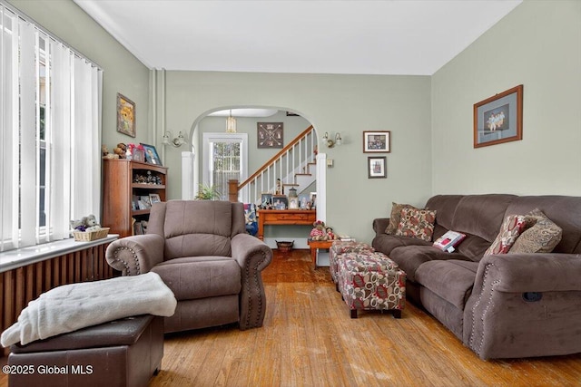 5 Hillview Ave, East Greenbush, NY 12144 - living area featuring arched walkways, wood finished floors, and stairway